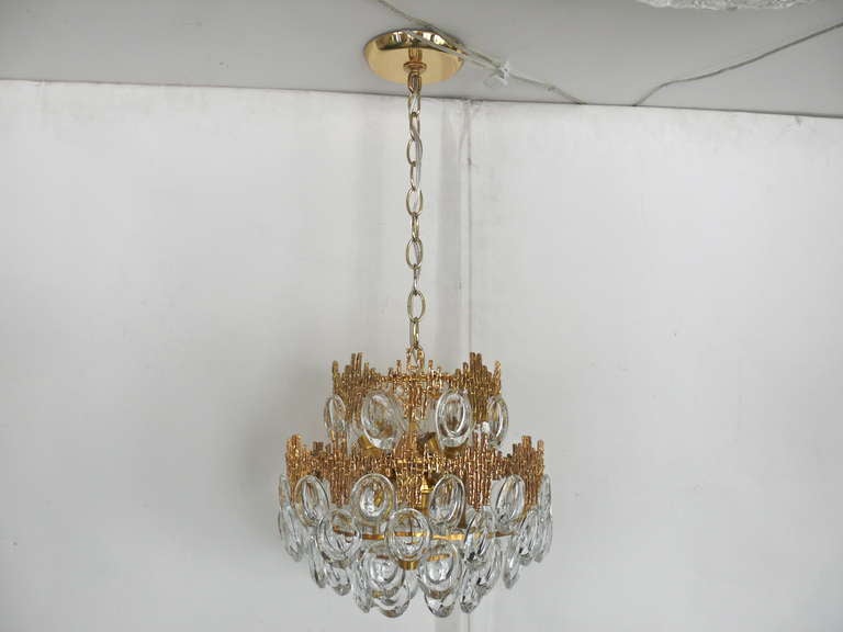 Exquisite petite Sciolari chandelier with individual jewel-like crystals hanging in multiple tiers from a double shaped textured brass rim. Gorgeous detail in the zig-zag textured brass. Professionally re-wired. Actual chandelier dimensions: 11.5