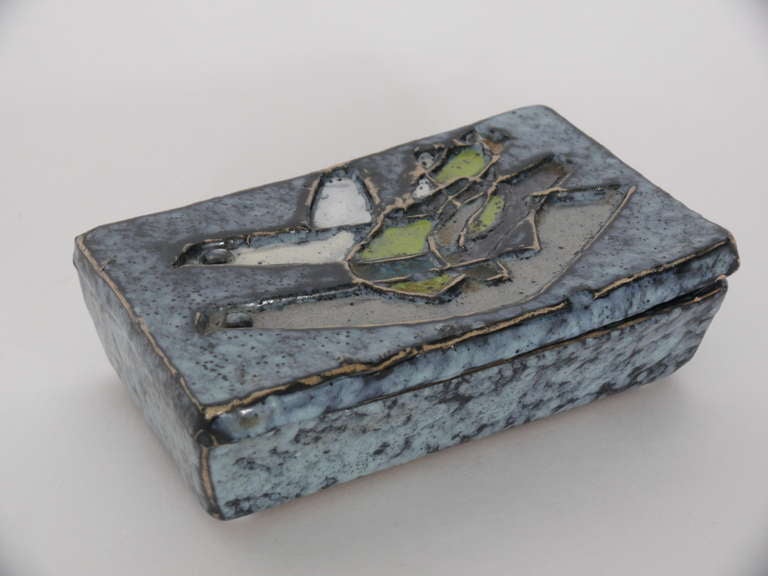 Stunning ceramic box with etched bird design on lid.  Gorgeous shades of blue, green, grey and white.  Perfect item to have on display. Original Raymor label on bottom of box.