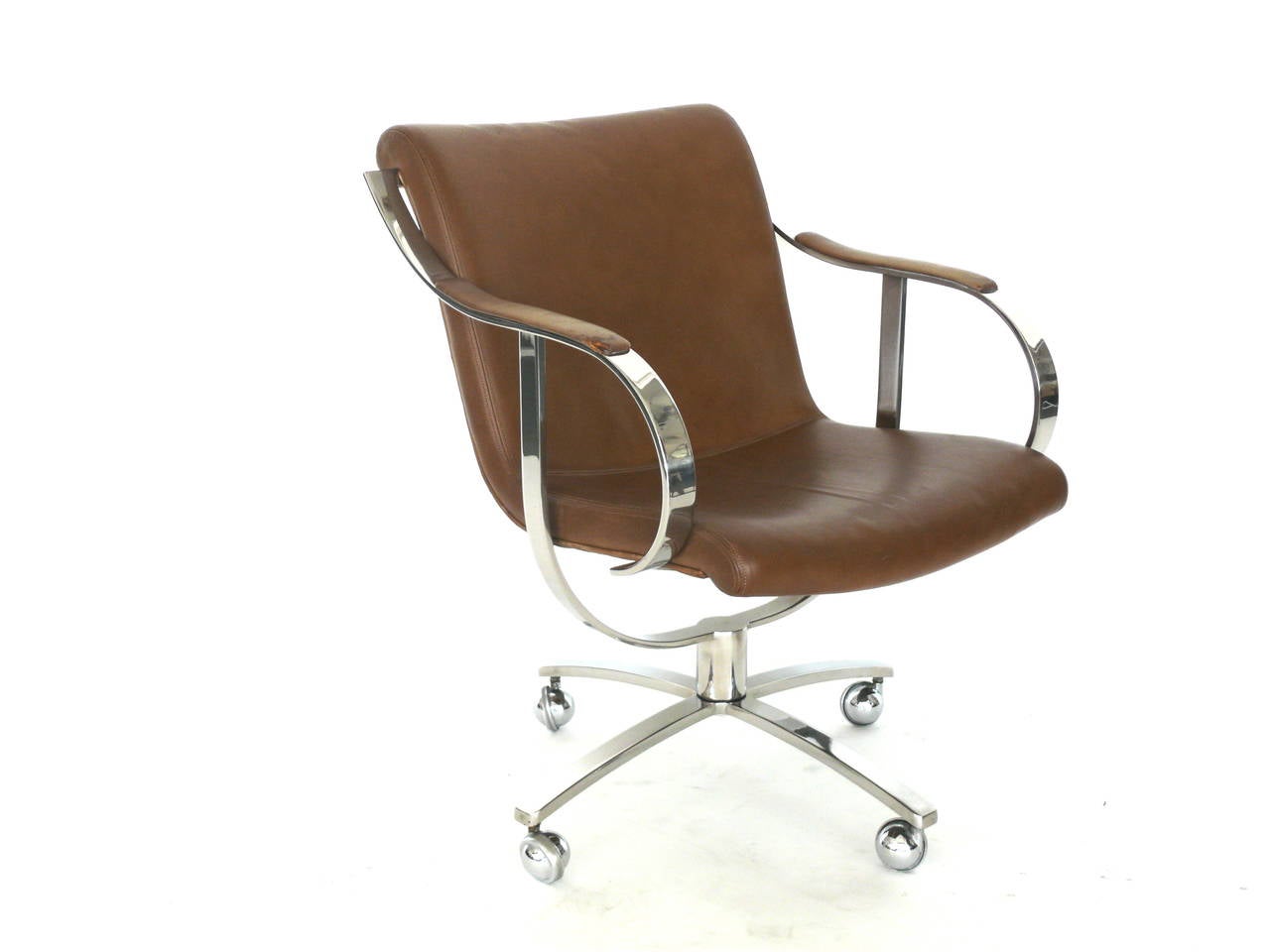 Handsome leather and stainless steel office chair by Gardner Leaver for Steelcase. Curved arms and U-shaped bracket add great design. New casters. Two chairs available. Each in their own vintage condition.