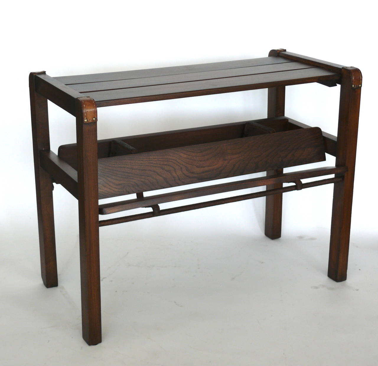 Handsome oak and mahogany magazine table by Jacques Adnet. Rectangular form with slatted top, inverted 