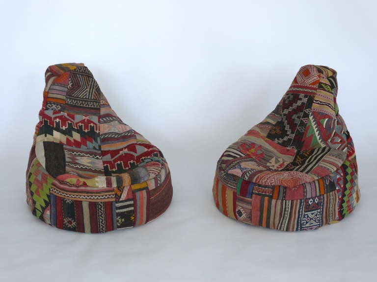 Incredible bean bag chairs newly sewn from over 100 year old turkish fabrics. Bright colored patchwork of differing patterns and designs. Made of a heavy wool fabric and stuffed with new foam beans. Multiple quantity available. Large and small poufs