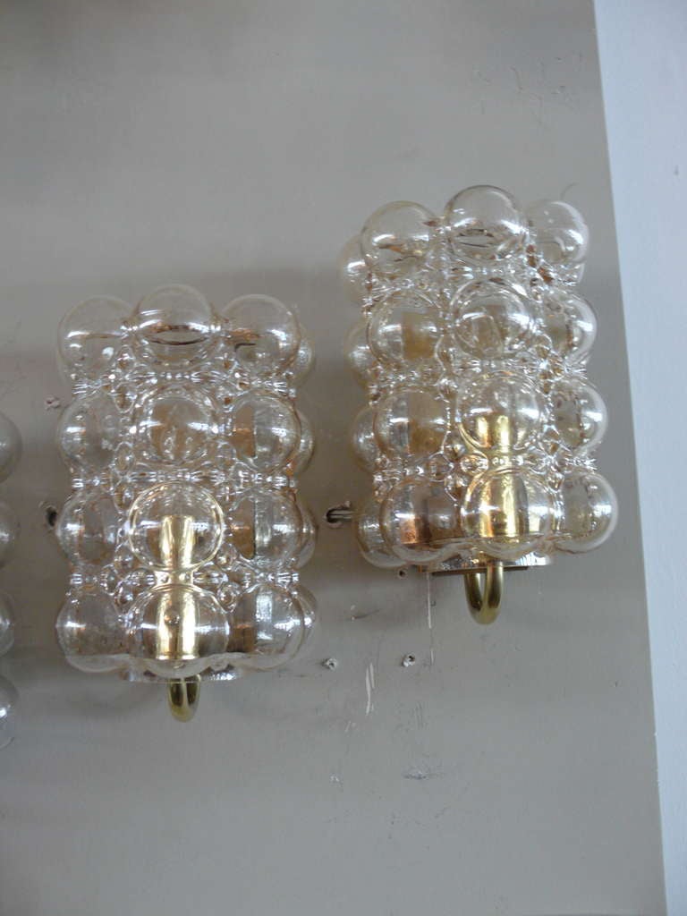 Great pair of cylindrical shaped Austrian bubble glass sconces with brass hardware. Amber colored glass. Professionally rewired.