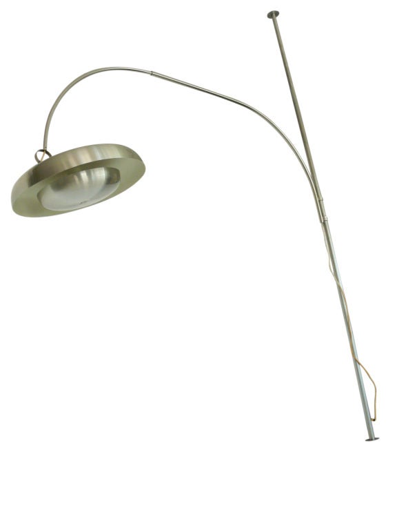 Giant floor to ceiling lamp designed by Pirro Cuniberti for Sirrah, Italy. Oversized brushed aluminum dome shade, adjustable stainless steel curved arm, and over 10 ft. stainless steel pole. Lamp is height adjustable and arm both swivels and rotates
