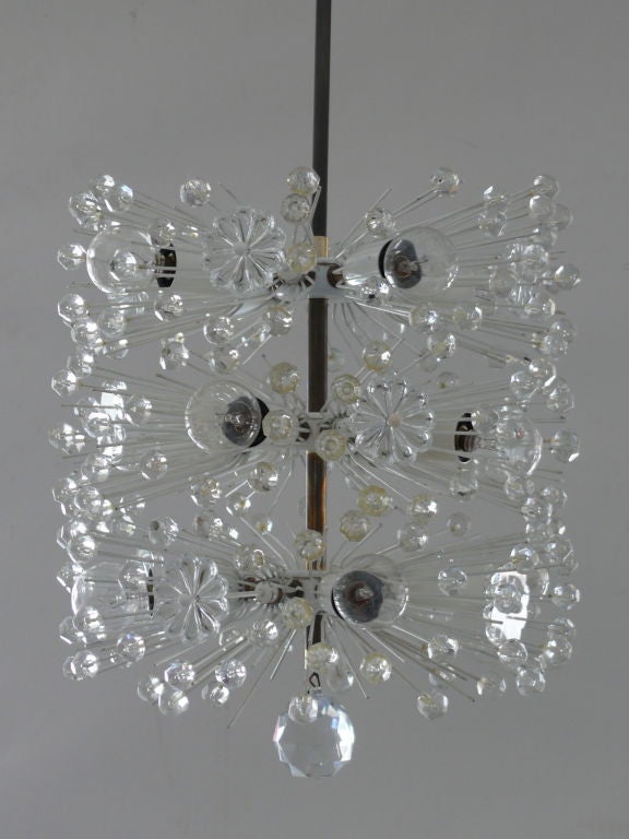 Gorgeous Austrian chandeliers with plexiglass flowers. In the style of a sputnik but a unique cylinder shape with 1 single crystal at the bottom. Two available and priced individually.