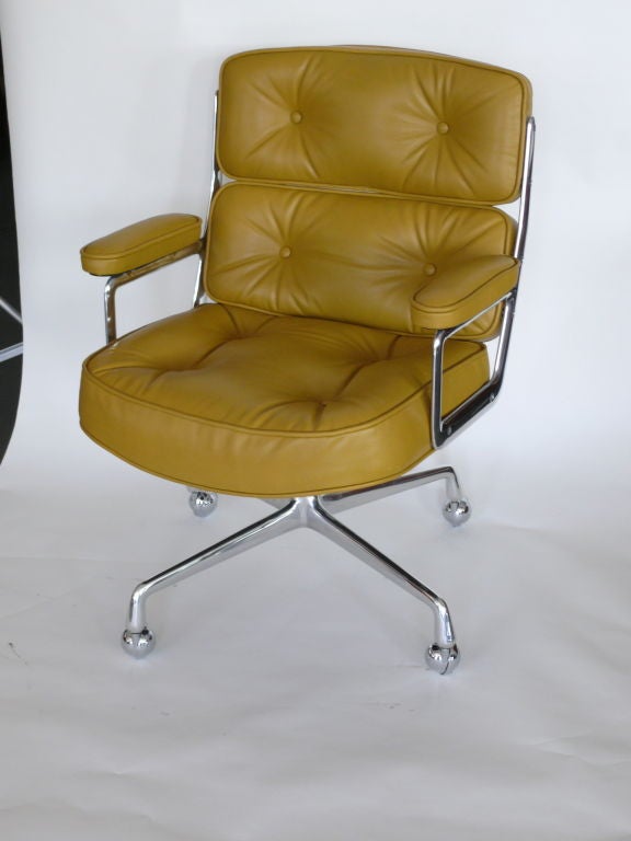 Classic office chair, from the Time Life building in New York. Designed by Eames. Newly upholstered in canary yellow leather with perfectly polished aluminum base. Multiple quantity available and may be reupholstered in any leather.