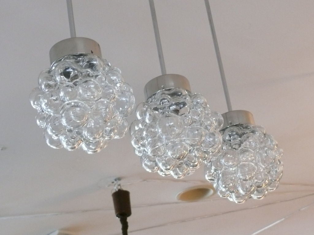 LImburg pendants with clear bubble glass globes and chrome hardware. 
Priced individually.
