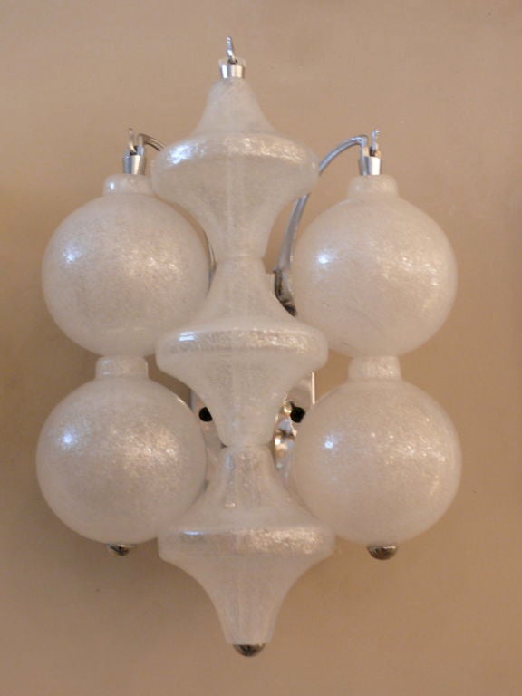 Classic pair of Seguso sconces with 2 different shaped hand blown glass.  Chrome hardware and newly rewired.