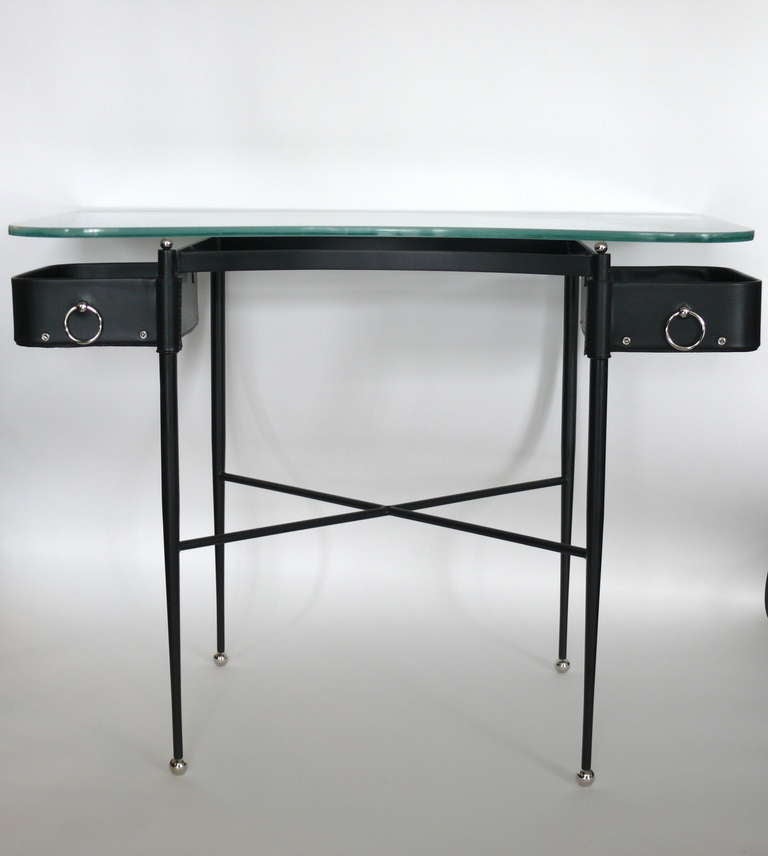 Gorgeous leather writing desk in the style of Jacques Adnet. Floating frosted glass top with open drawers that pivot. 