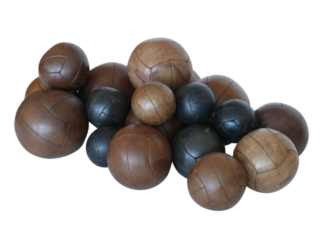 Wonderful collection of French leather medicine balls ranging in size and color. Some balls with maker's mark. Beautiful patina to leather.

Priced individually according to size:
Extra Large - 12.5