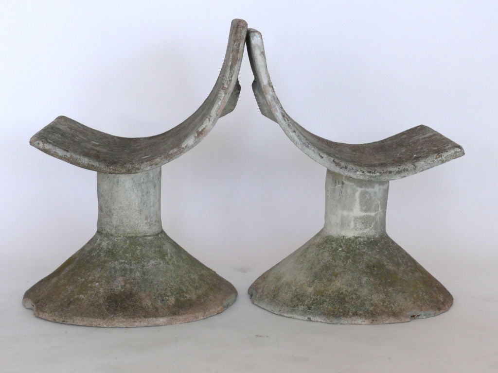 Incredible pair of cast concrete chairs, the scoop barrel seats resting on open tapering cylindrical legs. Beautiful wear to the concrete surface. Captivating, unique design.