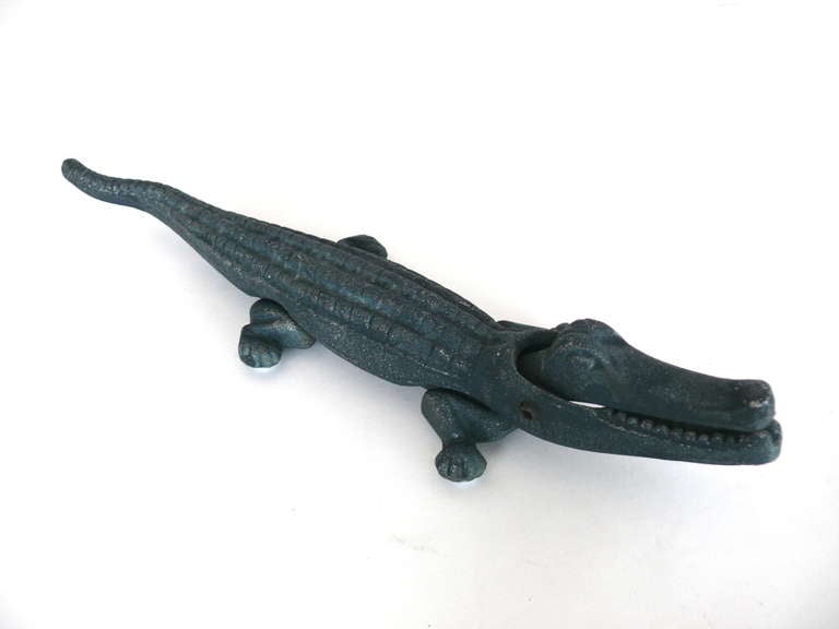 Whimsical alligator nutcracker with original green finish. Makes a great addition to any nut cracker collection or on a shelf with other smalls.