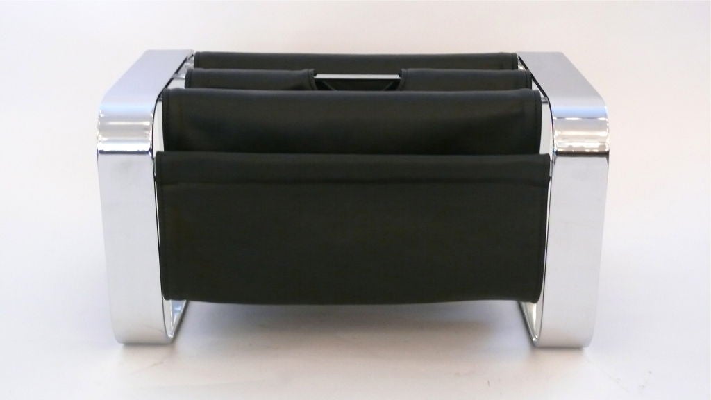 Sleek chrome and Leather magazine rack with new black leather slings to hold magazines or books. Great function and design.