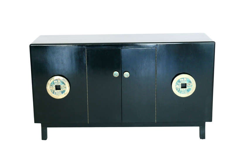 Beautiful enameled wood cabinet by Pepe Mendoza. Double sided cabinet with doors on one side and open shelves on other. Vibrant blue paint inside front cabinet. Original ebony wood finish with stunning turquoise ceramic and brass embellished