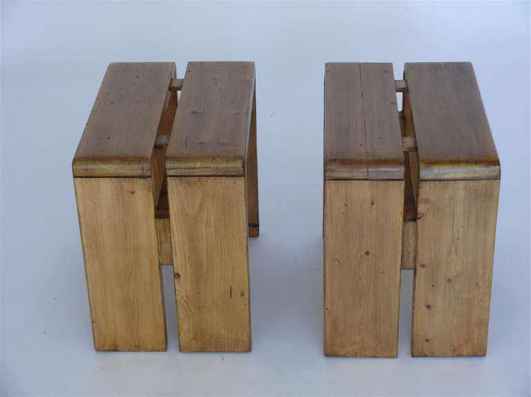 Pair of stools designed by Charlotte Perriand for Les Arcs ski lodge. Newly refinished condition. Priced individually. Pair of long matching benches also available.