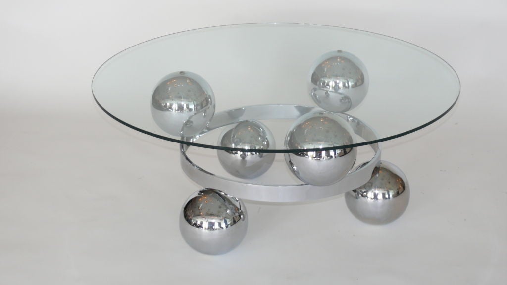 French chrome coffee table with six floating orbs around middle ring. Floating new glass top. Great design!