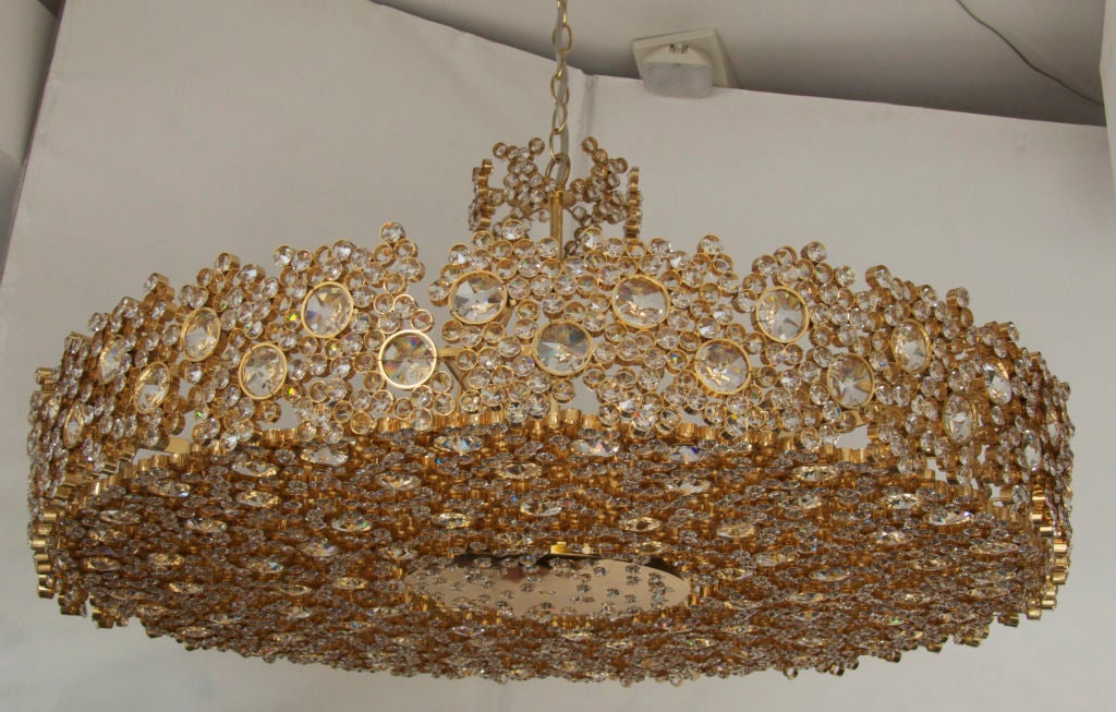 Spectacular giant crystal and brass chandelier by Lobmeyr. Gorgeous Austrian chandelier is made up of dozens of large individual 