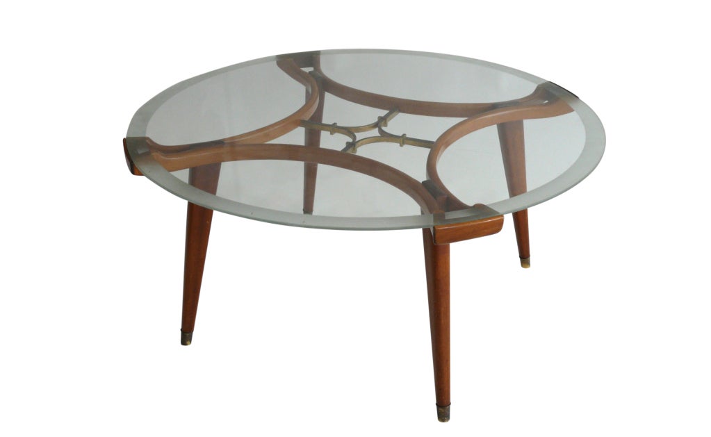 Amazing coffee table by Coffee Table by William Watting, in the style of Gio Ponti. Mahogany wood with original finish and unique brass detailing in center of table.  Original un-chipped glass with makers marks and frosted edge.