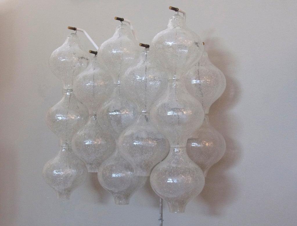 Incredible large wall sconces by Kalmar. Multiple hand blown hour glass shaped glass hangs from numerous arms. Professionally rewired.  Priced as a pair.