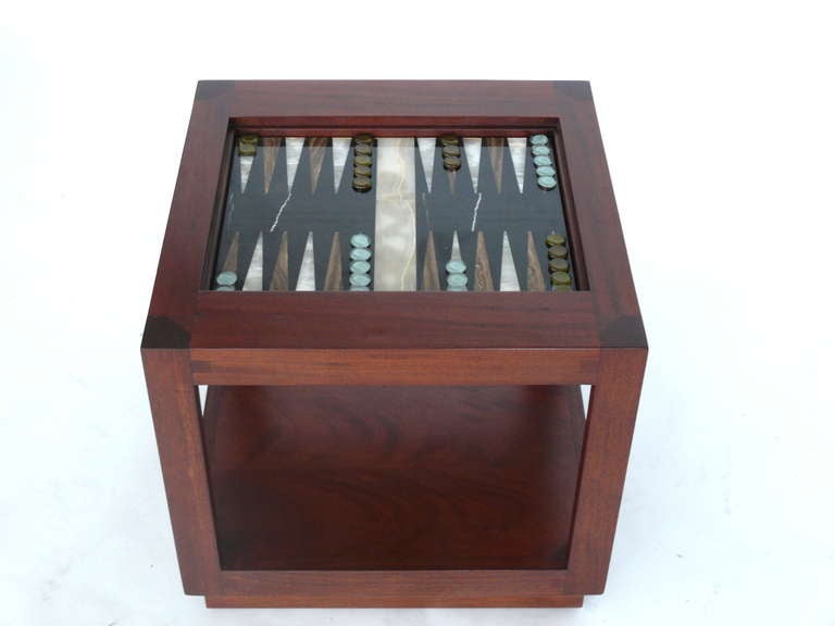 Incredible craftsman backgammon side table made of solid mahogany wood and newly finished. Based off of a 1960s design with vintage onyx and marble board and glass game pieces. Flat wood cover turns the piece into a functional side table next to a
