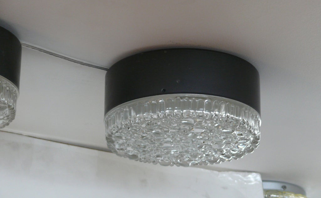 Beautiful flush mount with thick detailed bubble glass and ribbed edges on black metal fixture. Professionally re-wired. 