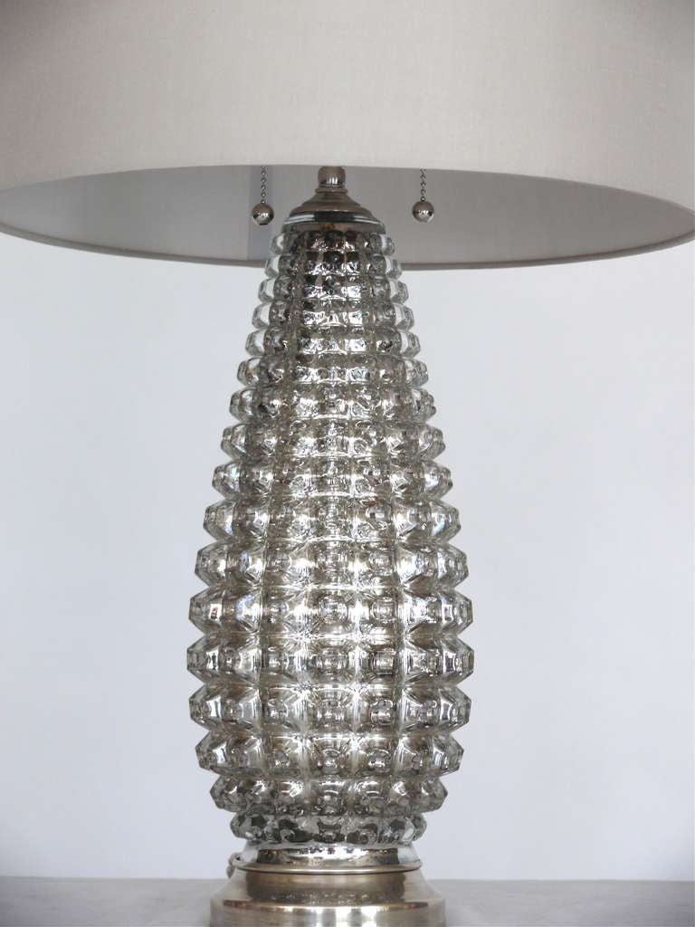 Pair of slender pineapple shaped mercury glass lamps with silver metallic glass and nickel base. New grey silk shades and professionally rewired.

Shade measurements: 11.25 H X 15.50 D