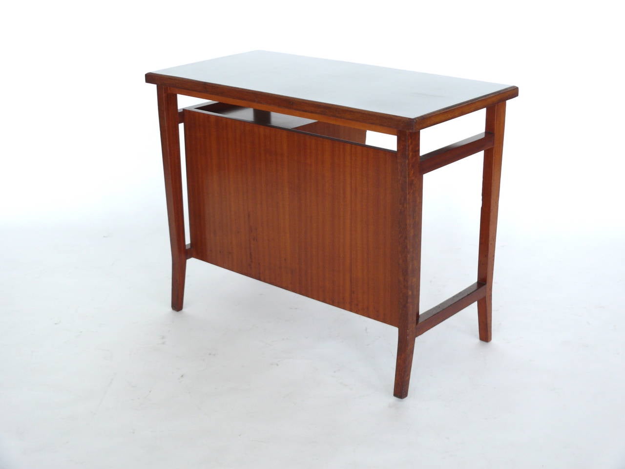 Petite architectural desk by Gio Ponti for the University of Padova. Four drawers suspend from right side of desk. Light grey Formica top in good vintage condition. Very rare piece and scale. Could be used as a vanity or entry table.