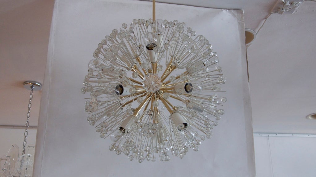 Beautiful Emil Stejnar sputnik chandelier with individual plexiglass crystals and flowers.  Original finish on white starburst arms and newly refinished polished brass base, stem, and canopy.  Professionally rewired. Multiple quantity and sizes