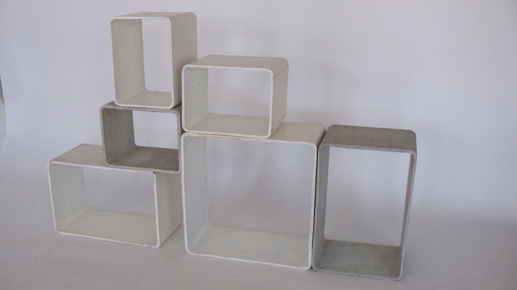 Incredibly rare cement and fiber modular shelving cubes by Willy Guhl.  Each cement cube is free standing and light weight enough to rearrange with ease.  Would make an incredible room divider, media storage, or display shelves!  The arrangement