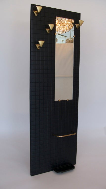 Sleek black French wall-sized coat rack and mirror.  Brass coat hooks and accents and black wood bottom shelf.  Fantastic modern design and great large scale.