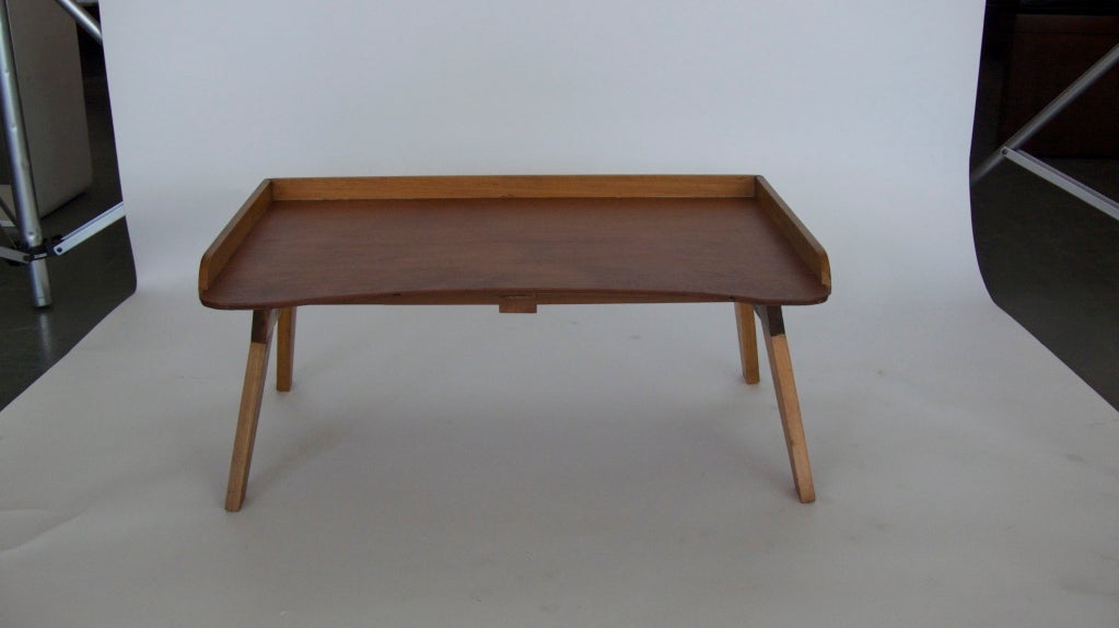 Vintage handcrafted folding breakfast tray.  Multipurpose table can be adjusted to a variety of angles for reading, drawing, etc.  Folds down into one thin piece easy for storage.  Carved with the makers name throughout the back of the table.