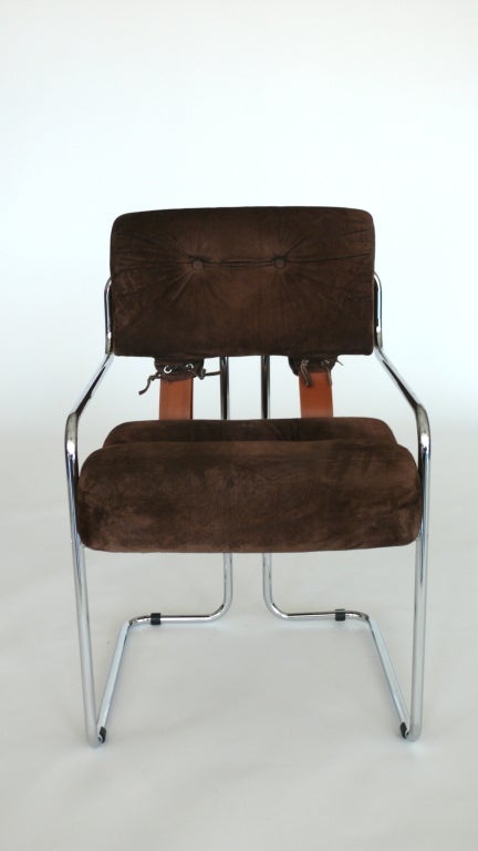 Handsome chair designed by Mariani for Pace. Upholstered in original chocolate brown suede with tubular chrome frame and light brown leather corset straps. Perfect for a desk or small dining table. Original tag on underside. Multiples available.