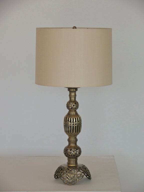 Incredible Moroccan style table lamps with perforated brass orbs and ornate dome base. Wonderful patina and age to brass. Newly re-wired and new silk shades.