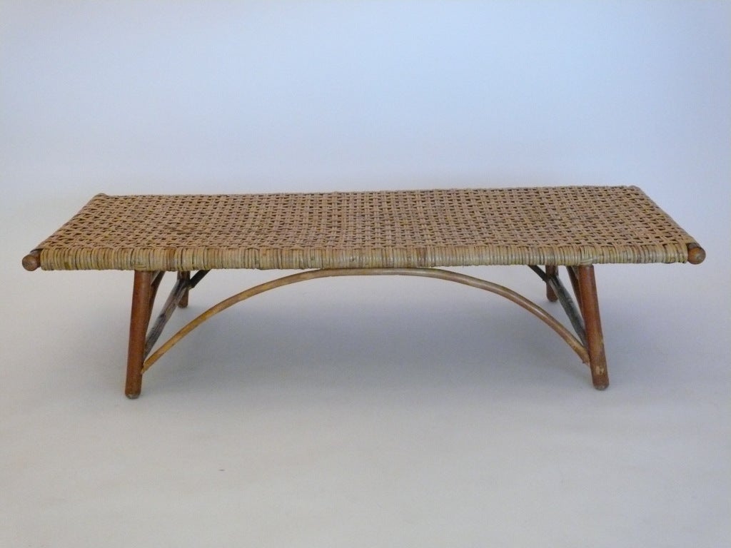 Beautiful vintage bench or daybed made of a hickory and bentwood twig base and large tightly woven rattan seat. Lovely arched curves and beautiful patina throughout. Perfect as a large bench for seating or as a daybed.