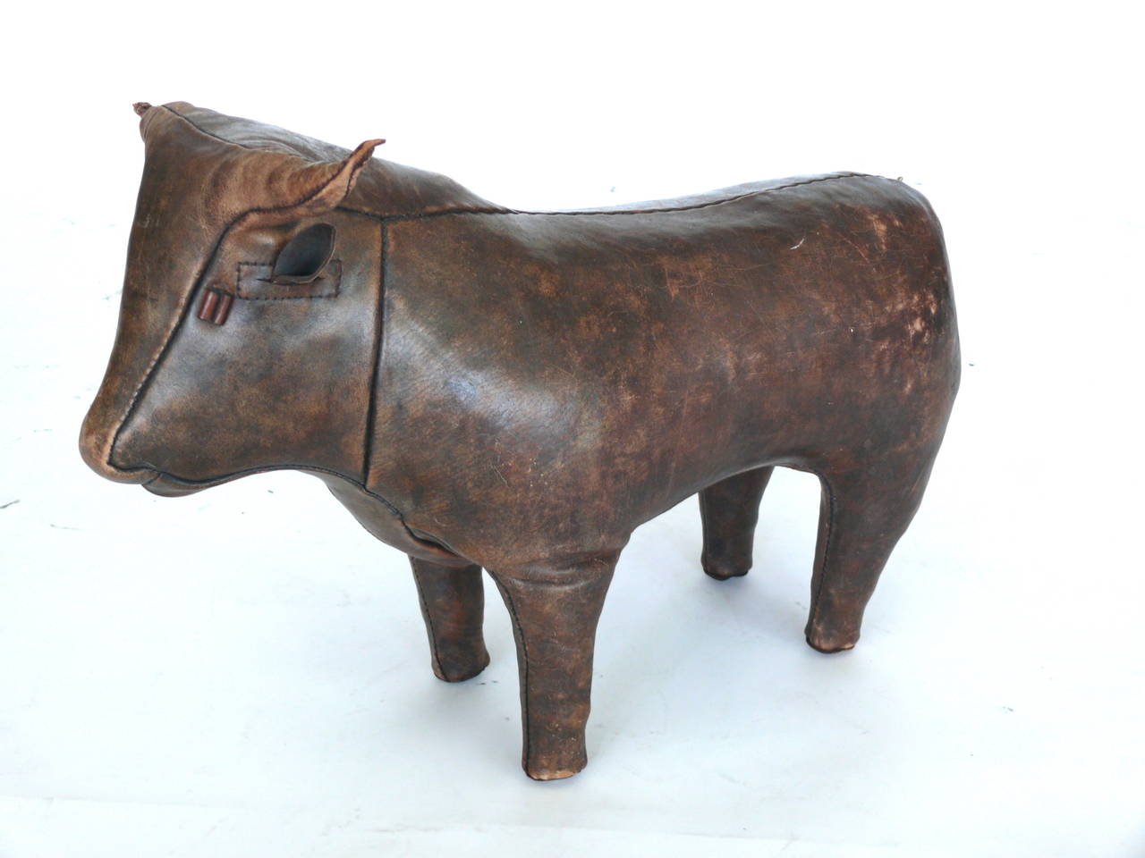 Handsome bull designed by Dimitri Omersa for Abercrombie & Fitch as a store display in the 1960's.  Great patina to leather.