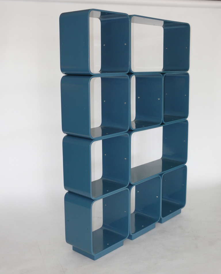 Fantastic collection of ten modular bookshelf cubes. Newly lacquered in a rich and bright teal color. Set includes 2 rectangular pieces and 8 square pieces. Cubes are extremely versatile as they allow you to create your own configuration. Cubes have