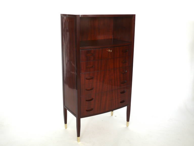 Exquisite pair of highboy dressers by Paolo Buffa and manufactured by Marelli and Colico from Cantu. 6 Pull out drawers with open compartment for storage. Top drawer locks for privacy. Beautiful slender tapered legs with brass feet elevate the piece