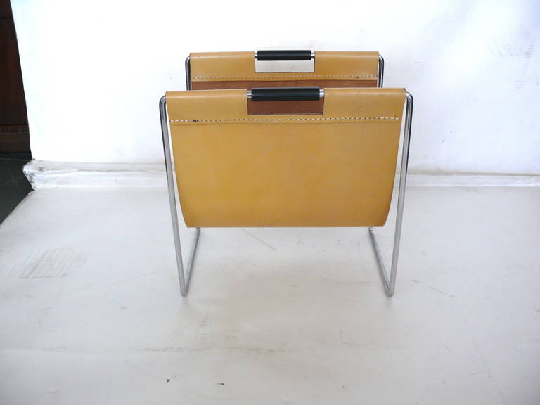 Handsome rectangular magazine holder with tubular chrome frame and leather sleeve. Large scale with ample room for magazines. Good condition with scratches towards bottom of leather sleeve.