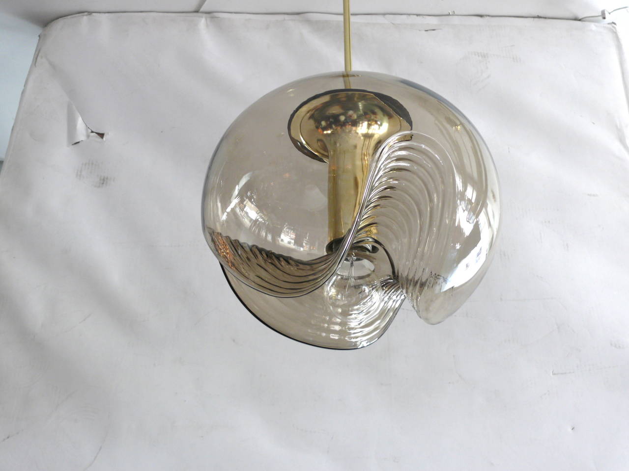 Fantastic biomorphic pendant light by Koch and Lowy. Amber colored hand blown glass with brass hardware. Large scale pendant. Newly rewired. Two available in this size. Smaller sizes also available.