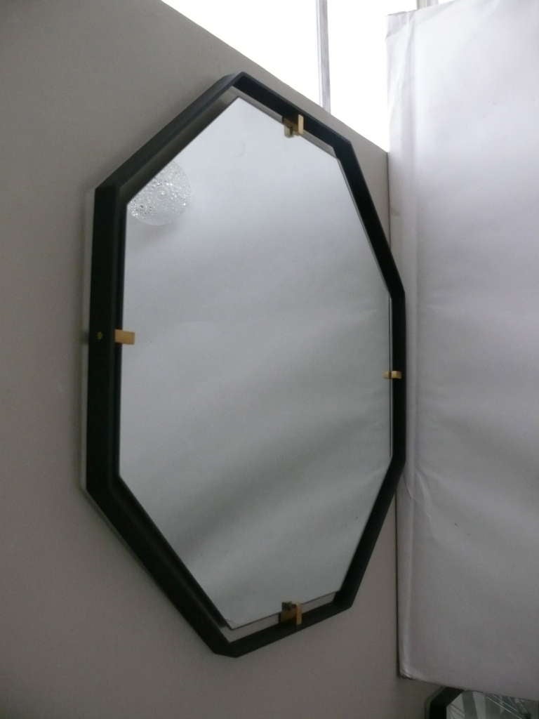 Outlined by a thin steel frame and held in place with solid brass clasps the Trousdale mirror is beautiful in any room. 
Custom sizes and finishes available.

Made in Los Angeles.