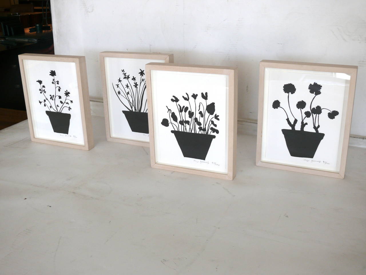 Fantastic set of four flower prints by Hugo Guiness. Hugo is a British artist known for his illustrations in the New York Times. His characteristic style used bold, black and white prints. Hugo made this set as a special Christmas edition for Neiman