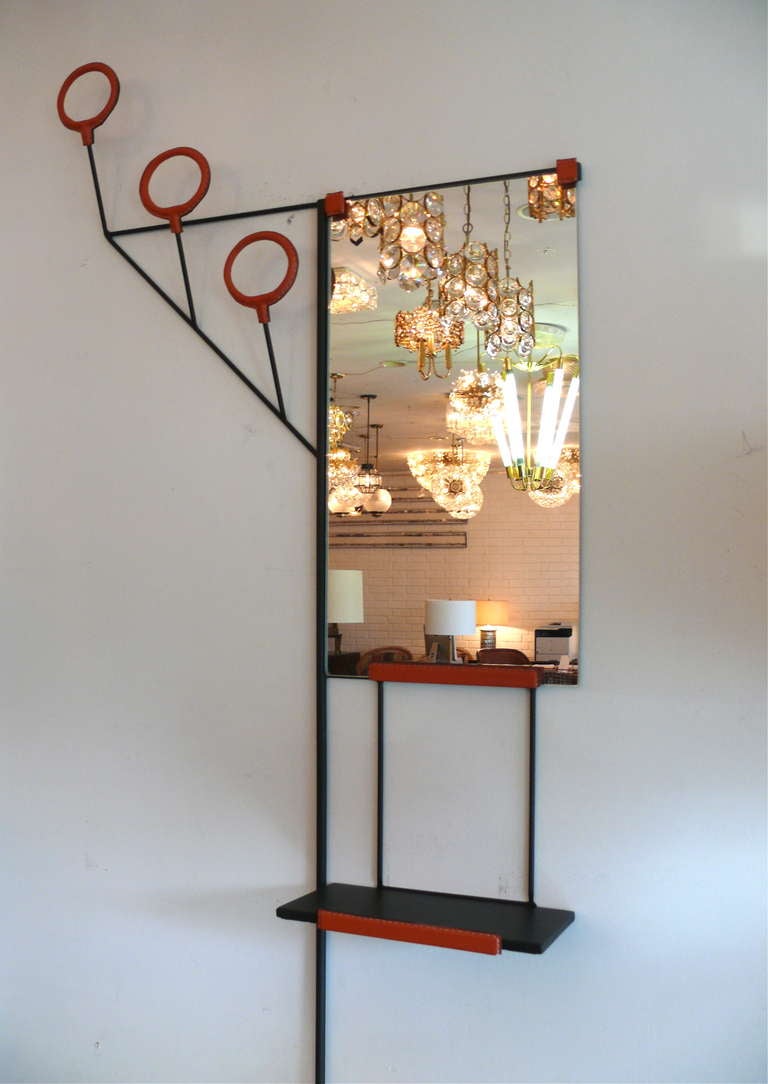 American Leather and Iron Wall Rack in the style of Jacques Adnet