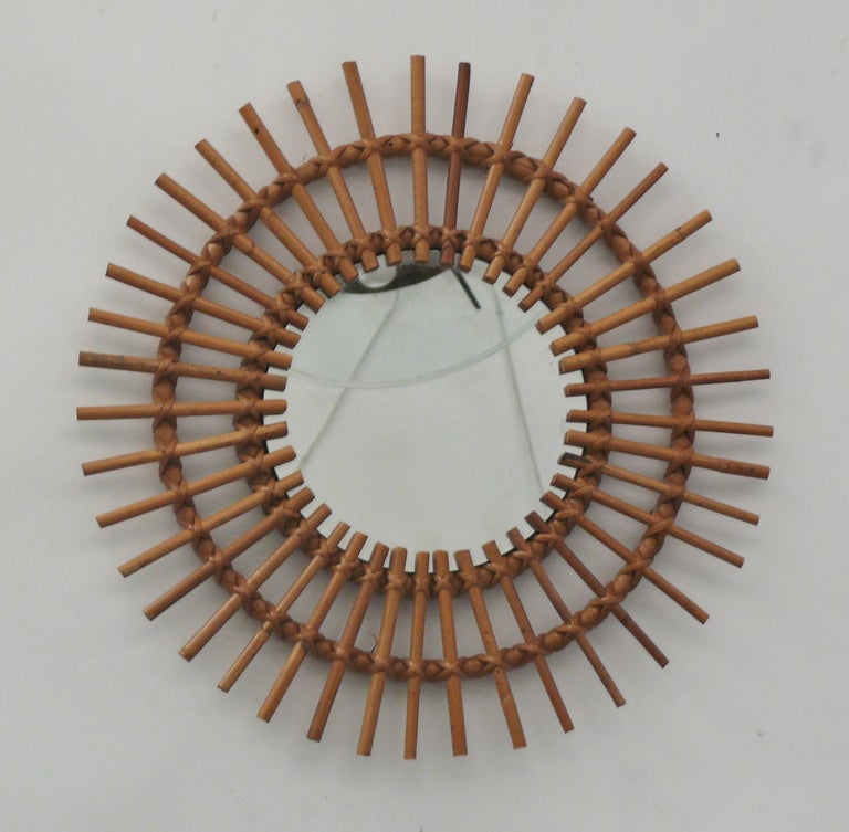 Incredible collection of vintage French sunburst mirrors made of bamboo and rattan. Varying shapes and designs including rare guitar mirrors. Beautiful hung together as a unique grouping. Multiple designs available and priced individually. Inquire
