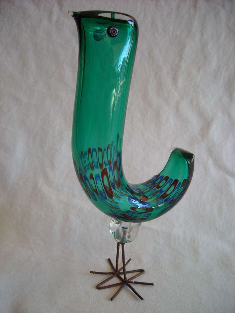 This is a rare and beautiful sculpture in glass made for approx only 2 years in Italy.The bird seems to be in perfect condition and with the original legs.