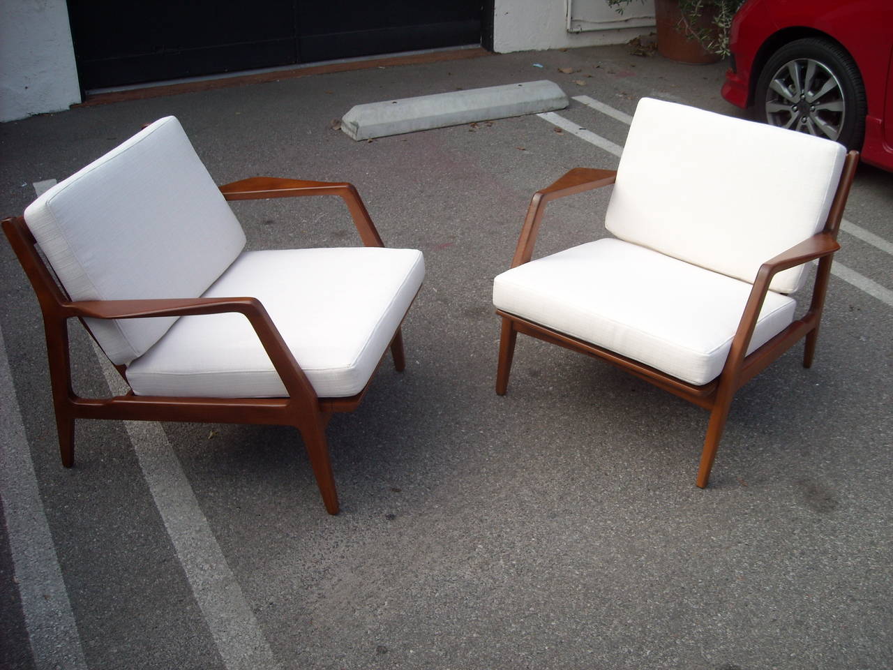 Very nice design in this pair of Mid-Century Modern food Larsen chairs. New teak finish and new cushions.