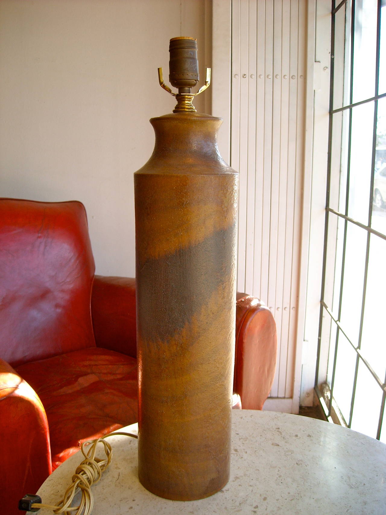 Very nice and tall ceramic table lamp by Marcello Fantoni. Made in Italy. The ceramic alone is approx. 19 inches high. Signed. All the parts are working, but all vintage original.