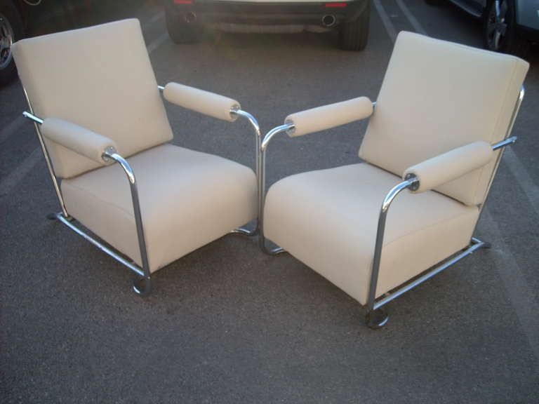 Very nice an elegant pair of chairs Designed by Gilbert Rohde, true Machine Age style.Nice new white bone color leather.