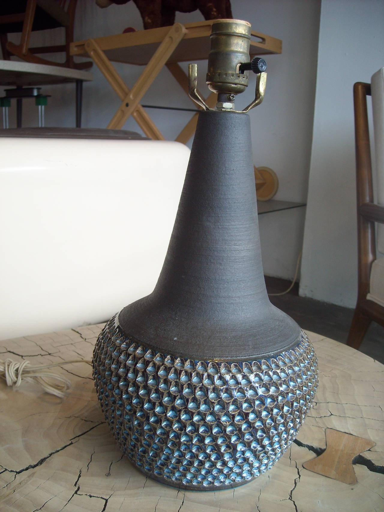 Very nice grey, charcoal, blue colors in this ceramic table lamp, made by Soholm. Vintage wire, working.