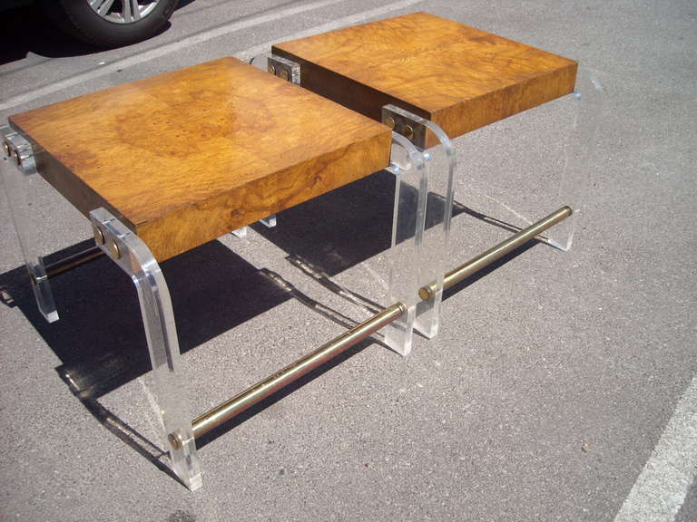 Great design in this pair of end tables with a very elegant combination of elements , brass finish,lucite and burl. Nice patina in brass with some faded finish .