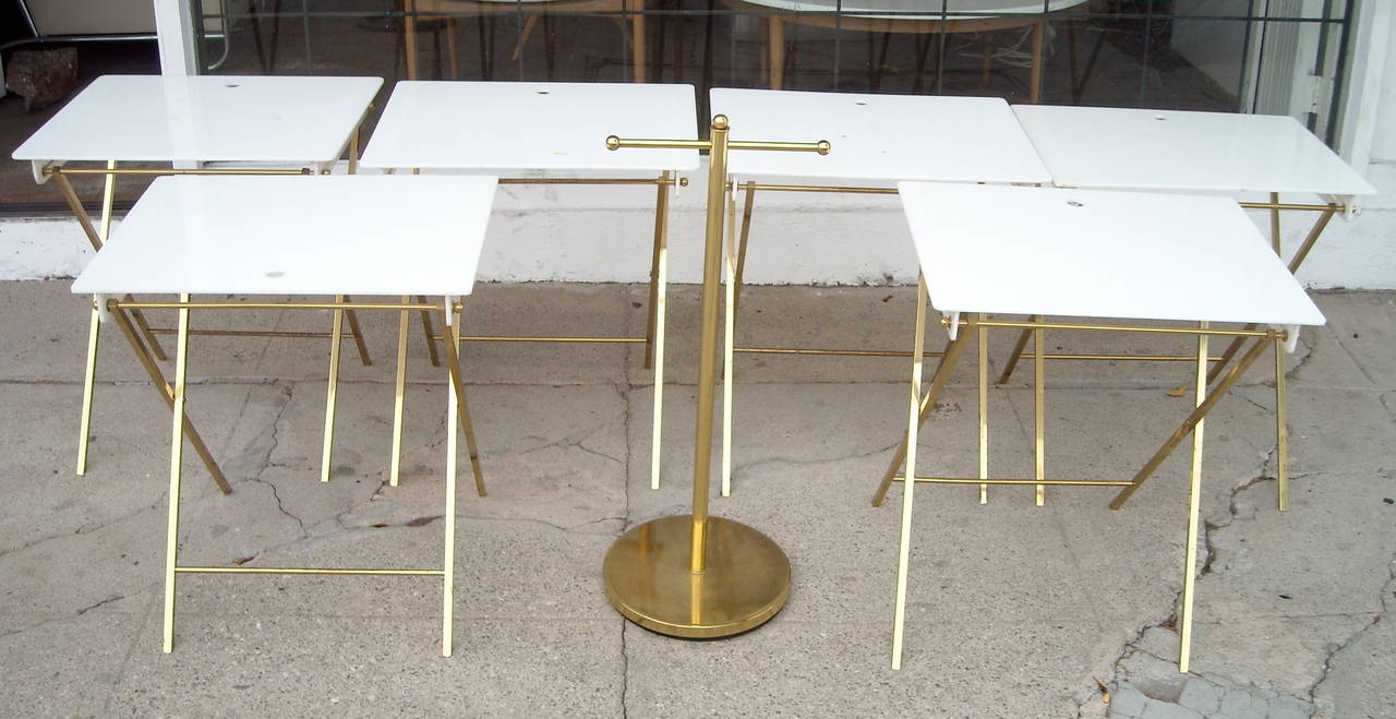 Very nice and easy and practical tables that can be putted away very easy. This pieces have a very important provenance. Measures are from an individual table. Not including stand. Some repairs and loses and scratches in brass and acrylic.