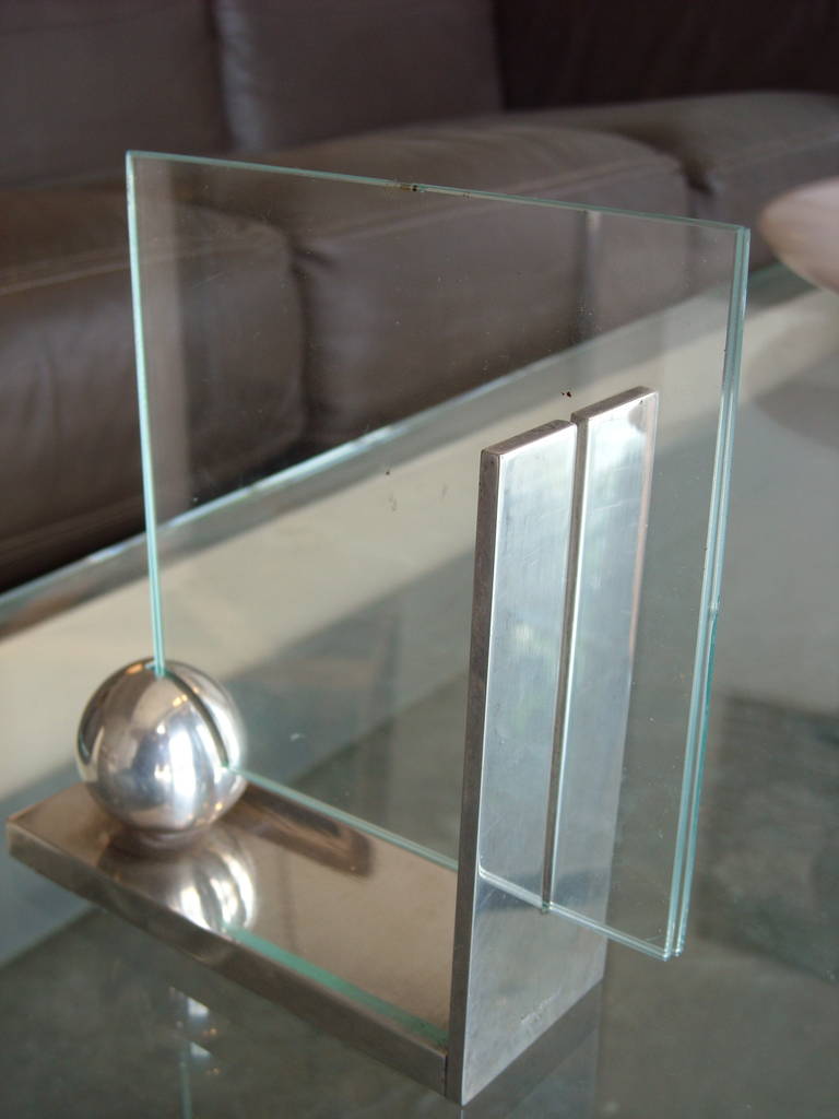 This is a just a very smart design, you can custom the two pieces of glass and it can hold many sizes of picture, like sample, 4x4. 5 x8 , 6 x 8 , 4 x 6 etc. Signed as shown.The over all measures are for metal, but as we said, can be altered by